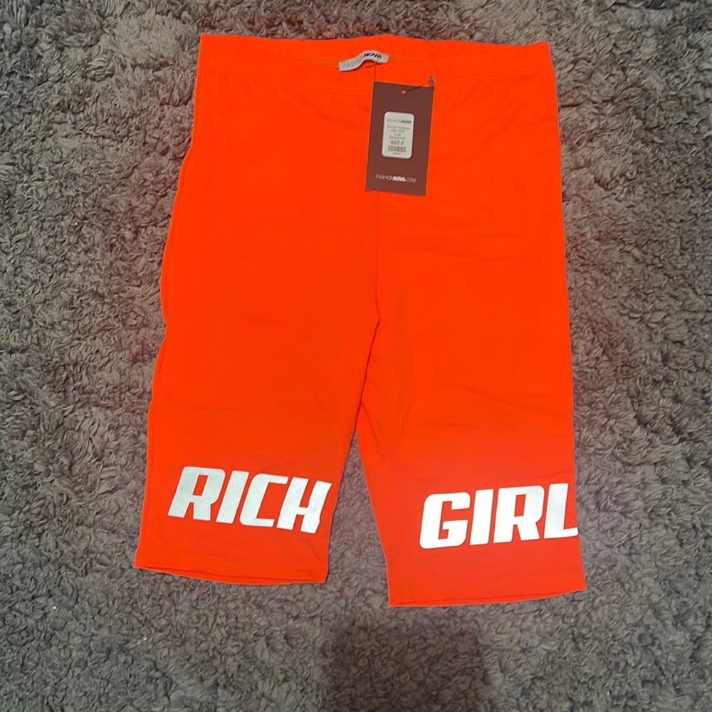 Reflective Rich Girl orange biker shorts